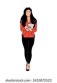 Business woman standing working on digital tablet.