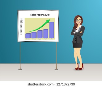 Business woman stands near presentation board with sales report