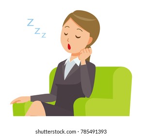 A business woman in a suit is falling asleep sitting on the sofa