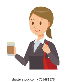 A business woman in a suit has coffee