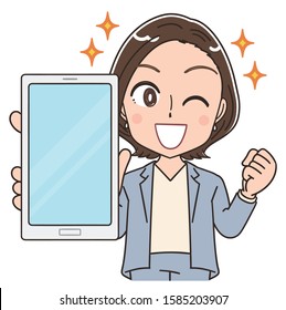 A business woman in a suit.She is holding a smartphone and showing the display to this side.