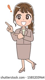 A business woman in a suit.She is pointing while looking at the left side.