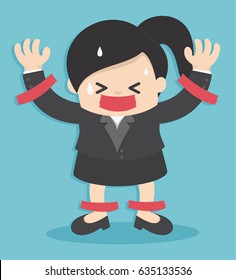 Business woman in suit is taped to the wall with adhesive tape