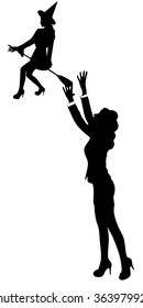 business woman trying to reach witch with her hands