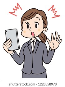 Business woman uses a smartphone. In a surprised expression.