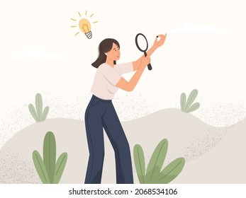 Business woman using a magnifying glass looking for new ideas
