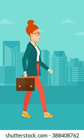 Business woman walking with briefcase. 