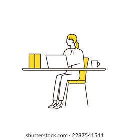 Business woman working on a computer at a simple desk
