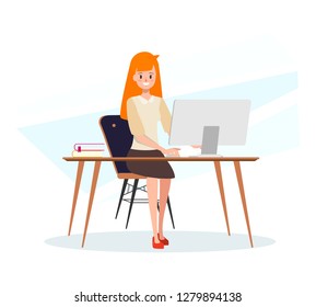 Business woman working on a laptop computer.