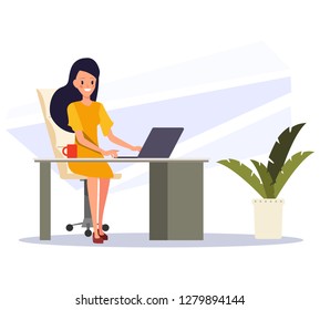 Business woman working on a laptop computer.