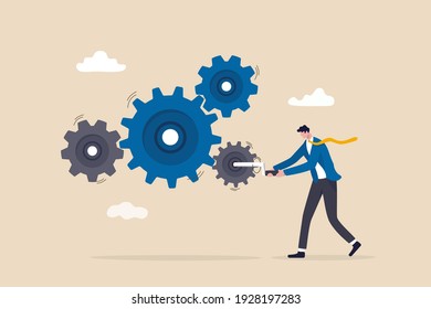 Business work flow, leadership to drive team and initiate productivity and efficiency working process concept, smart businessman manager use all his power and skill to rotate group of cogwheels gear.