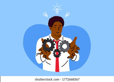 Business, work, success, idea, achievement, analysis concept. Young happy african american businessman clerk manager holding technology gear in hands. Productive work moving towards goals illustration