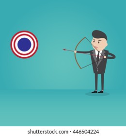Businessman aiming a bow to the target
