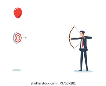 Businessman with archer bow with flying target