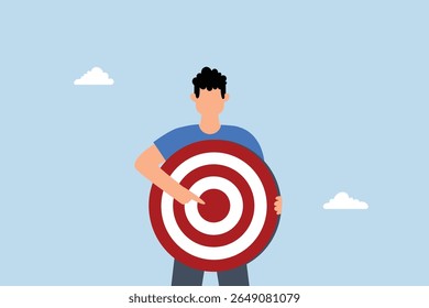 businessman with archer target pointing at bullseye.
