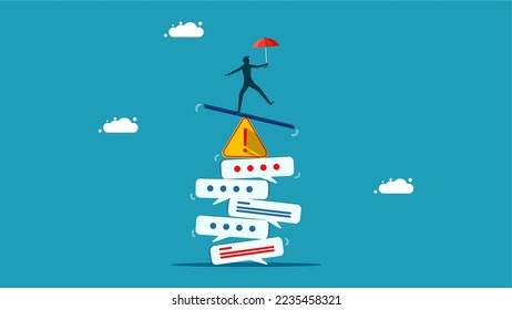 Businessman balancing on piles of warning messages and warning exclamation marks