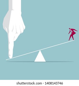 Businessman being tilted up. Isolated on blue background.