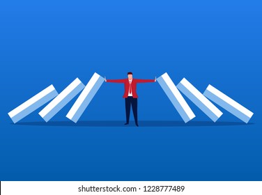 Businessman blocking domino effect