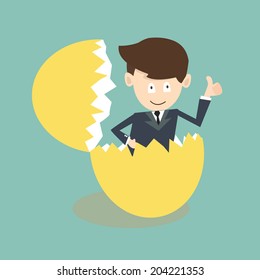 Businessman Breaking Out Of An Eggshell