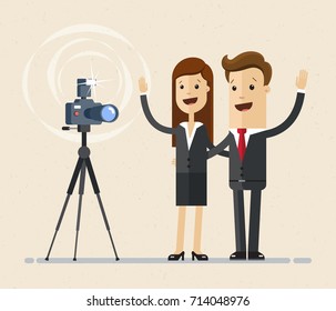 Businessman and business woman makes are doing a photo shoot. Vector, flat, illustration