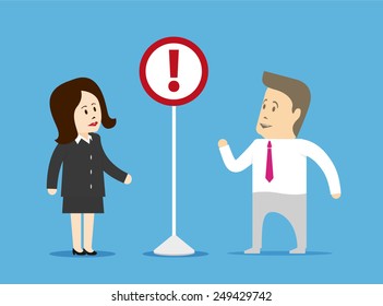 Businessman and businesswoman looking at a sign installed