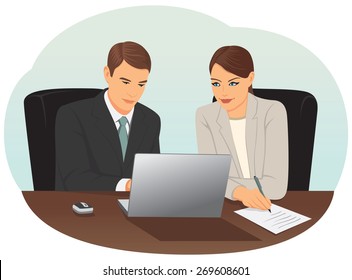 Businessman and businesswoman are working with a laptop in the office