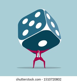Businessman carrying huge dice. Isolated on blue background.