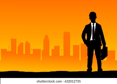 Businessman with city and sunset