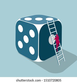 Businessman climbs a huge dice using a ladder. Isolated on blue background.