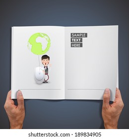 Businessman with computer mouse printed on book.
