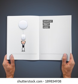 Businessman with computer mouse printed on book.