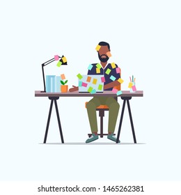 businessman covered with stick notes business planning deadline concept african american office worker using laptop sitting at workplace flat full length