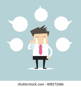 Businessman crying about negative comment with balloon text