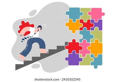 Businessman is diligently assembling puzzle, for concept building company or department in corporation. Businessman builds own career, wanting to achieve success in business and rise to new level