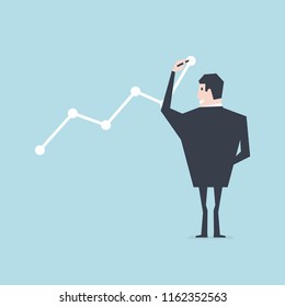 Businessman draws graph of growth.