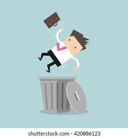 Businessman dropped into trashcan layoff concept