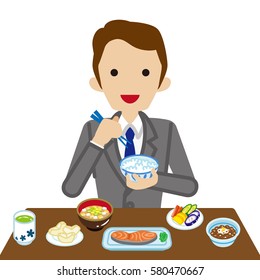 Businessman eating Japanese breakfast