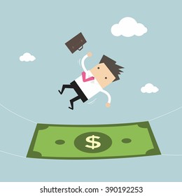 Businessman falling into a money banknote. Business concept 