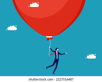 Businessman floating with a big soap bubble. investment and business risks