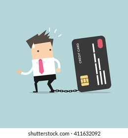 Businessman with foot chained to bank credit card trying to escape.