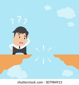 Businessman in front of a gap and looking into the empty space underneath