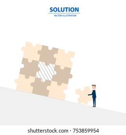 Businessman fulfill the puzzle by pieces together in a logical way, in order to arrive at the correct solution. Business concept of success, solution, management and decision.
