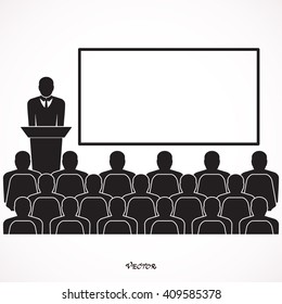 Businessman giving a presentation standing next to a blank white board. 
