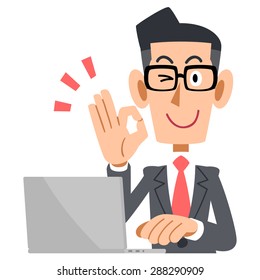 Businessman with glasses showing a sign of OK and laptop