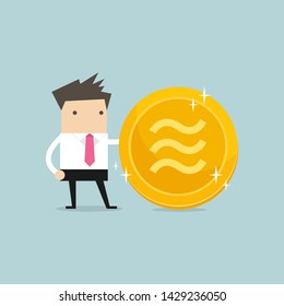 Businessman with golden Libra coin. Crypto currency virtual electronic money.