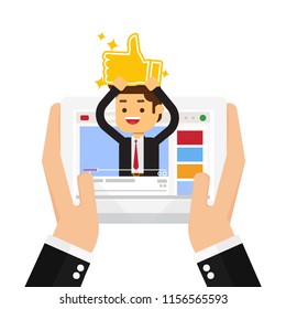 Businessman with golden like is in his video blog on the screen