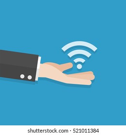 businessman han give wireless signal on blue background