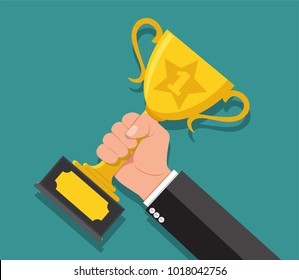 Businessman hand holding Gold Trophy Cup. Winner trophy award. First place. Gold Trophy Cup. Flat vector illustration.He was awarded the rank 1.Winner concept.