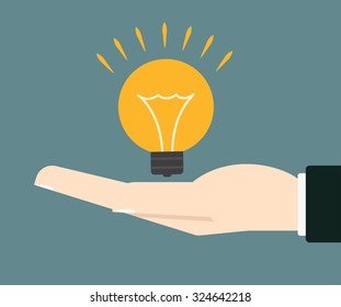 businessman hand holding lightbulb concept of idea