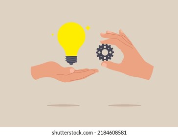 Businessman hand holding lightbulb idea implementing cogwheel to make it work. Implement business idea, new innovation, optimization or solution.